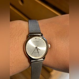 Ladies Peugeot Quartz Watch silver and gold face circle (watch work perfectly)